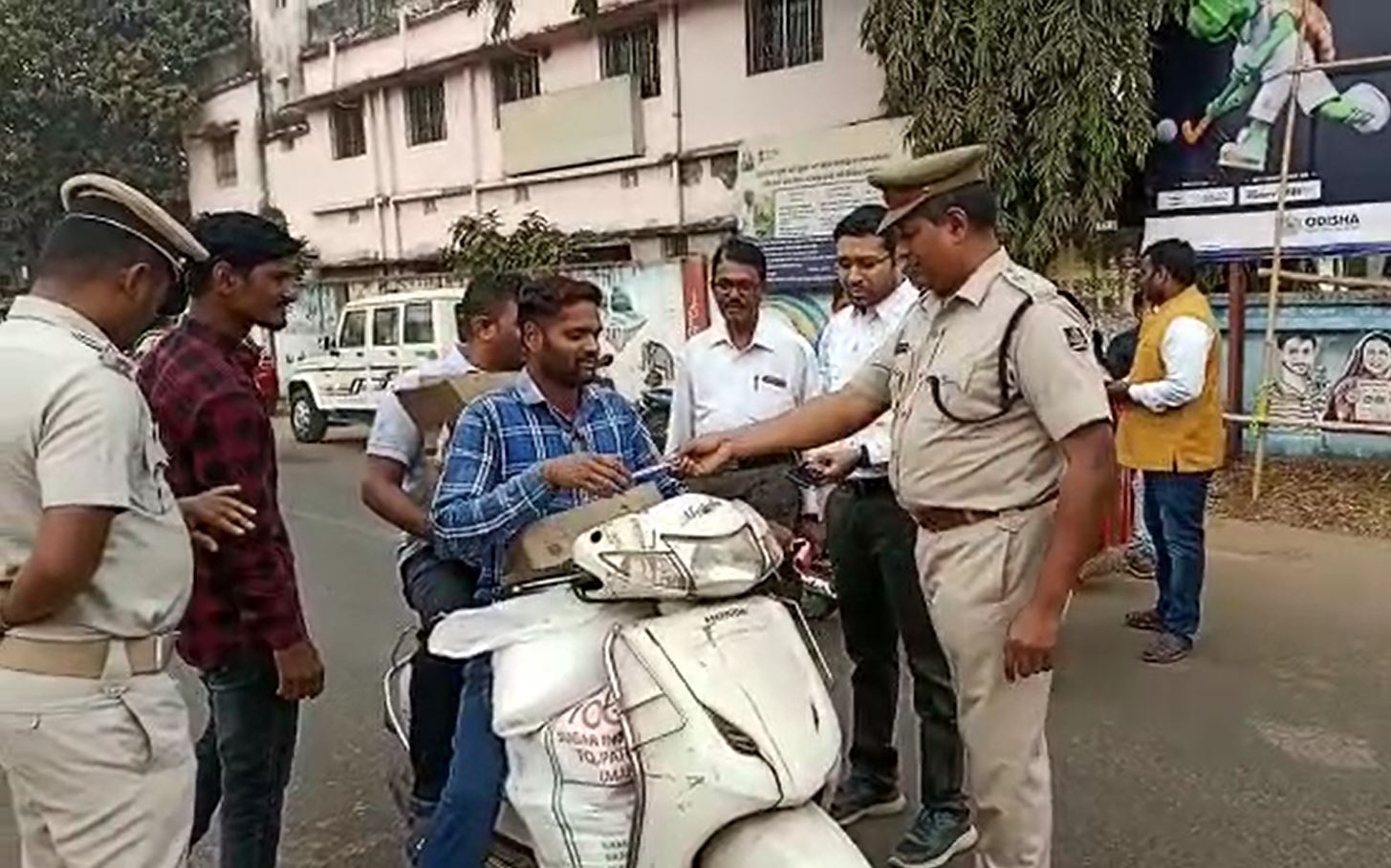 Administration Aware Traffic Rule Violators Giving Rose And Chocolates In New Year At Kamakhyanagar